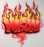Mason hand-painted in red, orange and yellow flame letters with black outlines and red swirls on a white shirt
