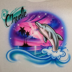 Chevelle personalized airbrush design with a leaping dolphin, curling blue wave, palm silhouettes and a pink, purple and gold tropical sunset.