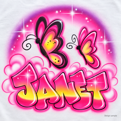 Design sample: Janet in pink-and-yellow bubble letters with two simple freehand butterflies, cloud outlines and soft purple glow.