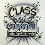Class of 2024 airbrushed in dimensional silver-gray numbers with black lettering, swirls and starburst accents on a white shirt.