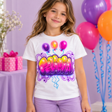 Illustrative mockup of a child wearing a white Felicia balloon-and-bubble-name shirt with purple shorts in a coordinated pink, purple and orange birthday party setting.