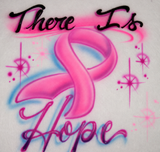 There Is Hope hand-airbrushed awareness shirt with a pink ribbon, shaded script lettering, blue accents and soft pink stars on white fabric.
