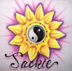 Warm yellow petals frame a shaded black-and-white yin yang symbol. Purple accents and a soft glow surround the flower, with your name in flowing script below.